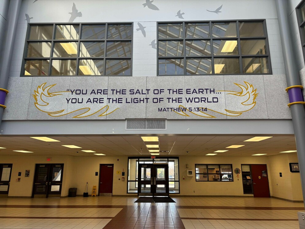 Picture of a bible verse on a wall